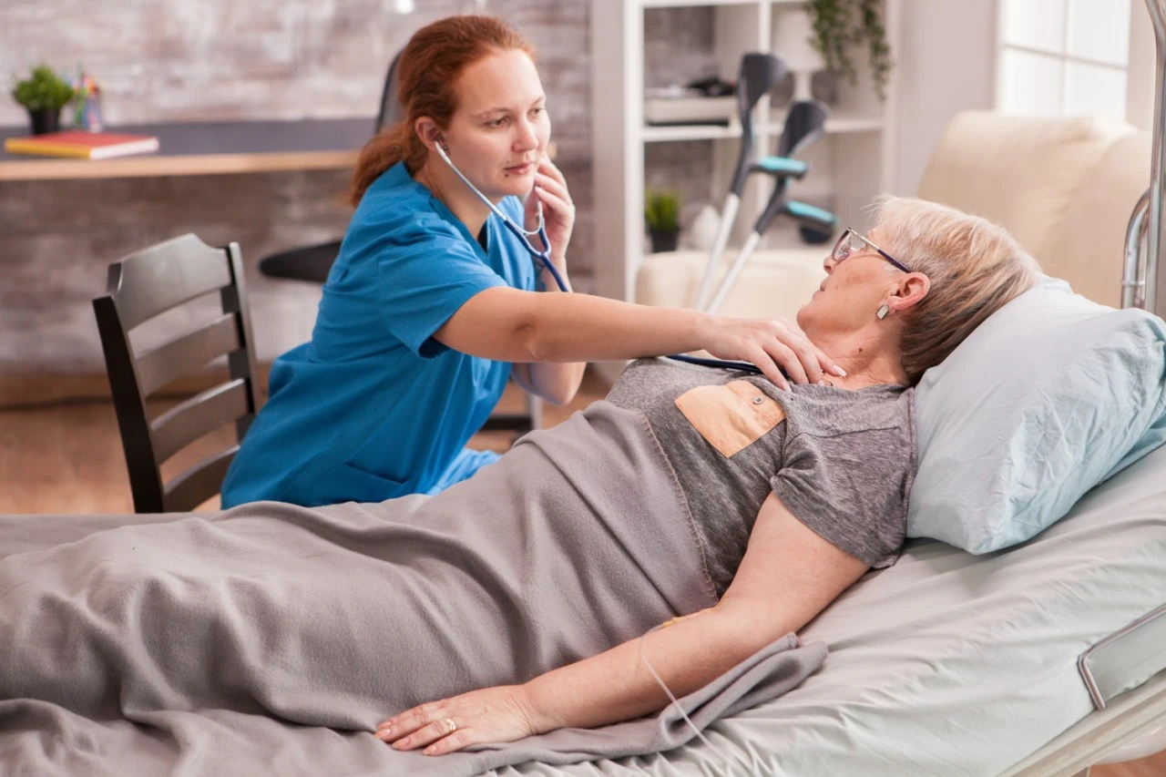 Caregiver assisting a bedridden patient with Home Care Services Patna at home